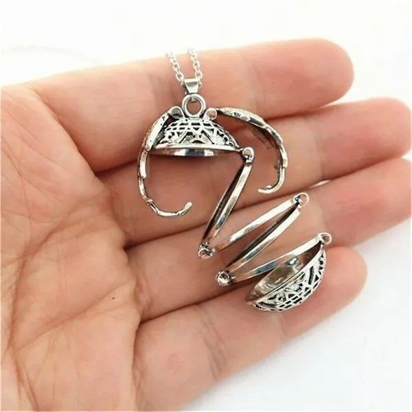 Winged Sphere Expanding Photo Locket